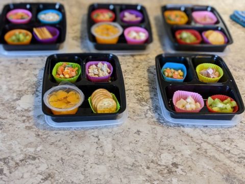 daycare lunches in meal prep containers on counter
