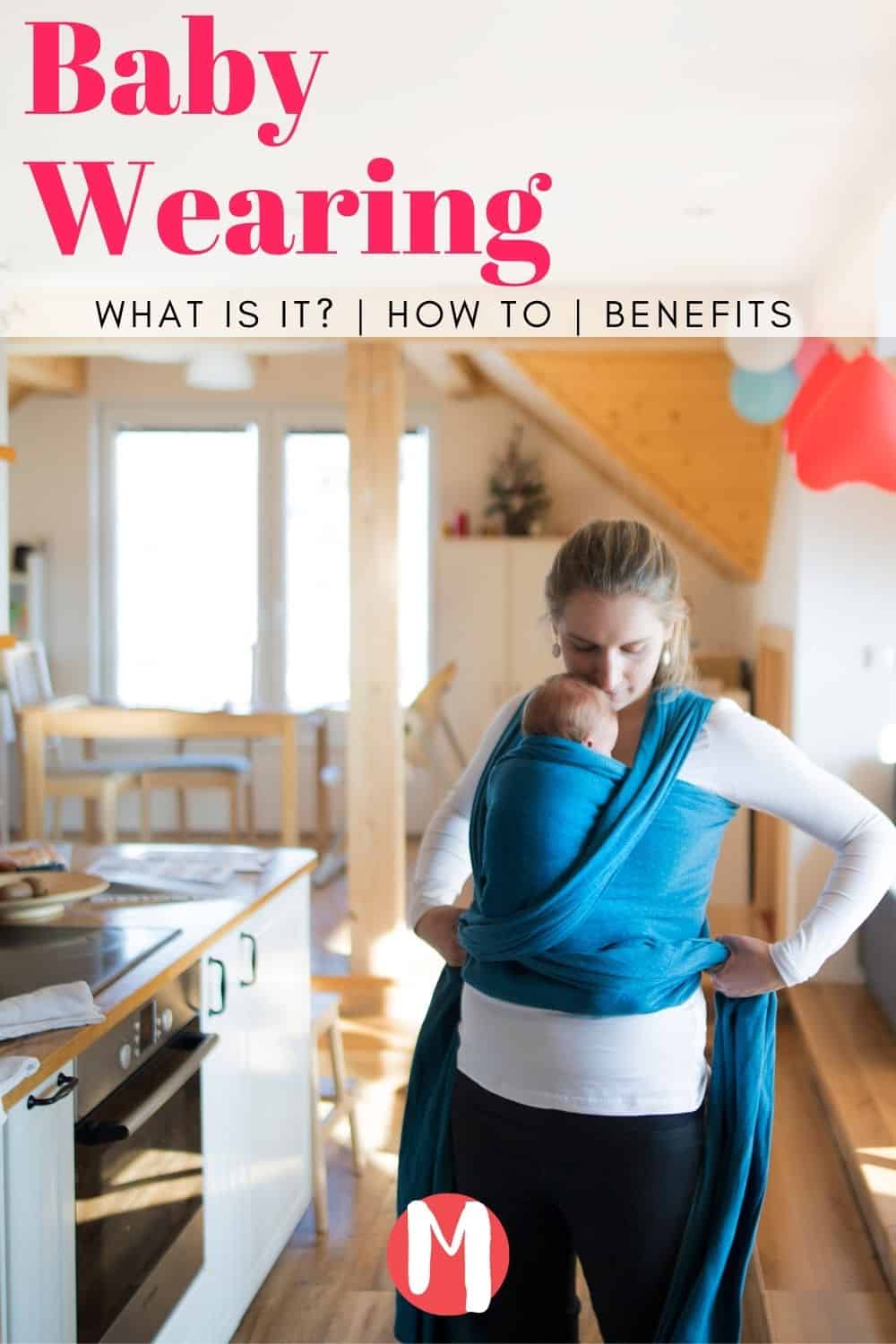 Mom with her baby in a baby wrap sling preparing lunches while the baby sleeps.  Baby wearing.  What is it?  How To & Benefits. Mommy Maker Teacher.