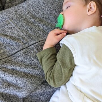 Baby wearing cotton sleep sack.