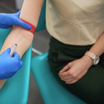 woman getting a pregnancy blood test