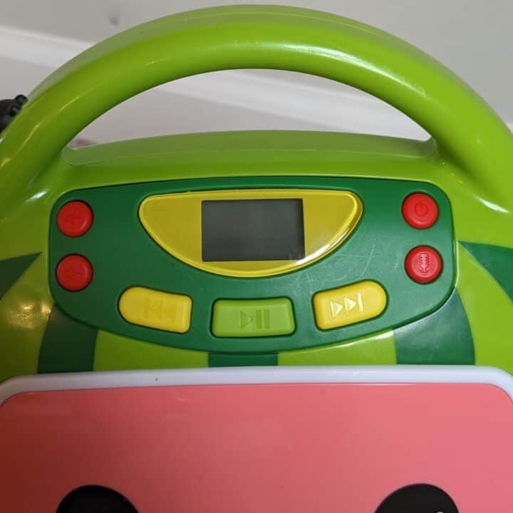 Control buttons on the front of the eKids Cocomelon karaoke player.