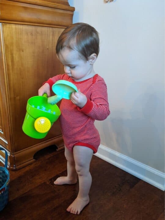 Toddler boy with watering can