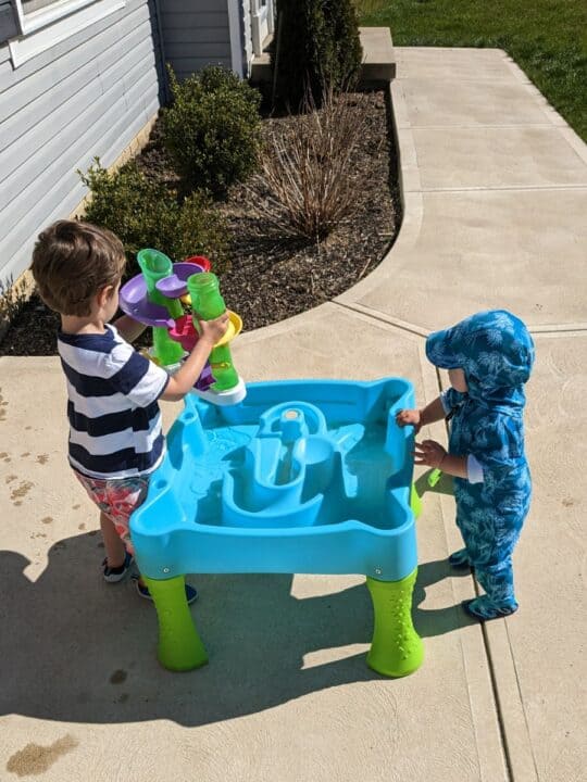 Two toddlers playing at Step2 water table