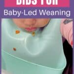 The best bibs for baby-led weaning. A toddler eating with a silicone bib.