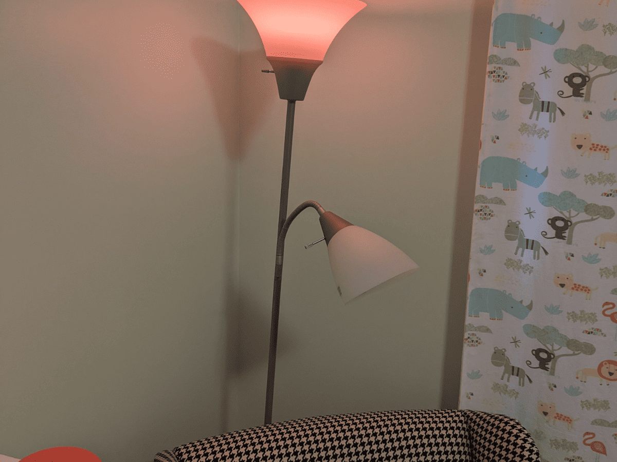 Floor lamp with reading arm for nursery. 