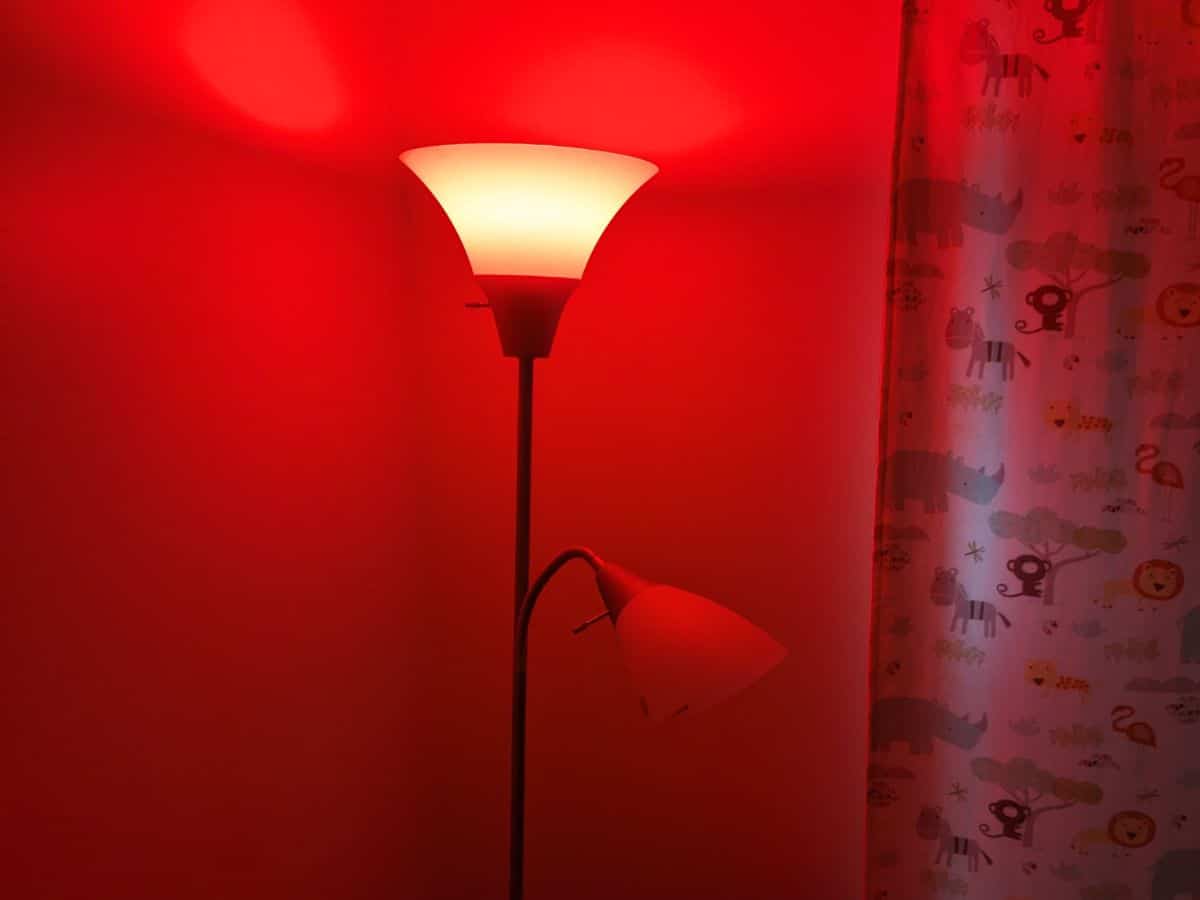 Lamp with red light bulb for nursery