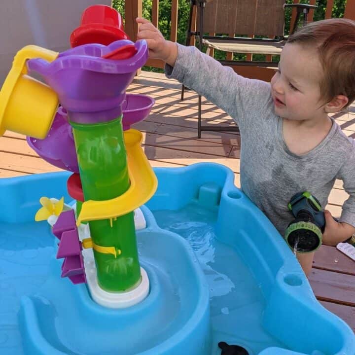 14 month old playing with water table