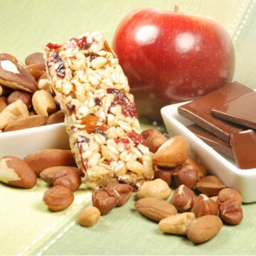 apple, granola bar, assorted nuts, and chocolate for a well balanced hospital snack.